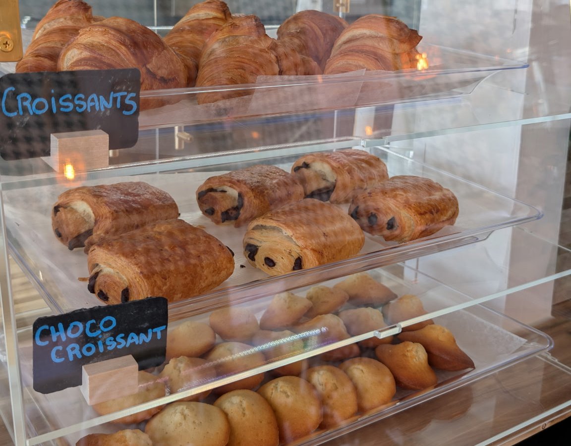 The Madly Madeleine pastry display case with croissants, chocolatines and madeleines